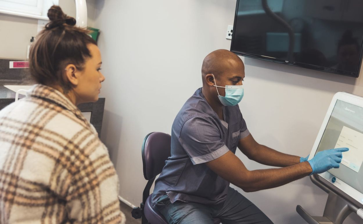 Dentist talking with a patient at Mortiboys Dental Spa, East Horsley